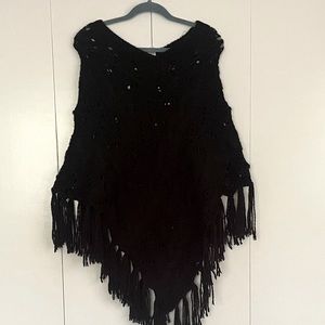 Black poncho with fringe